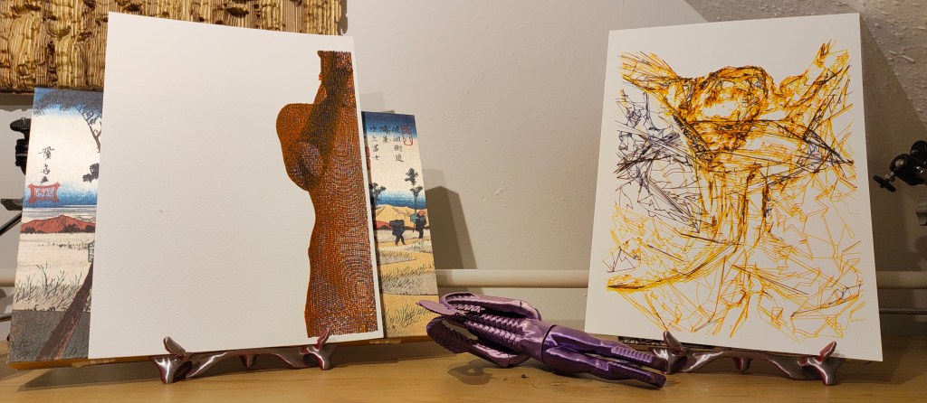 An art display featuring two artworks on easels. The left artwork features a textured silhouette in orange, while the right features an abstract composition with yellow and blue lines. A purple sculpture is placed in front of the artworks.